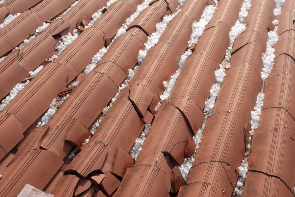 Damaged clay shingles after a hail storm will be a costly replacement.