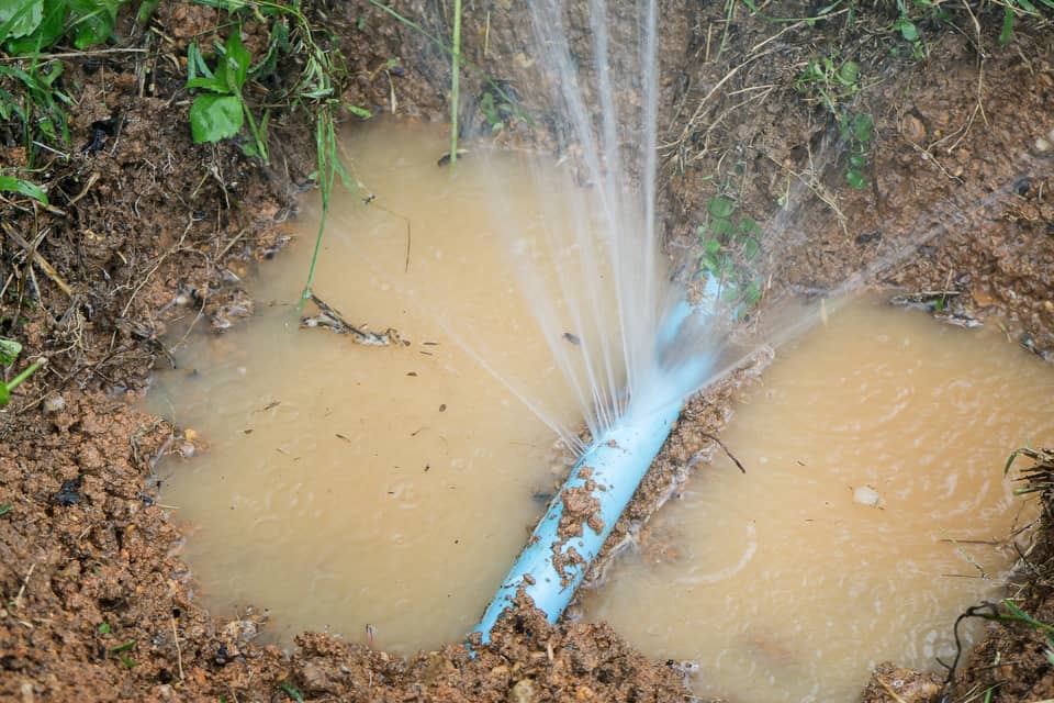 A broken main water line is a cause of air to get into your water pipes. 