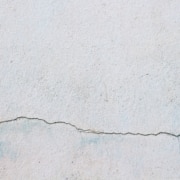Is Fixing Stucco Holes or Cracks a DIY Project?