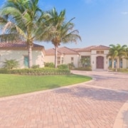 Image 1 (who pays for a home inspection.jpg): "Exterior view of a large, single-story luxury home with a paved driveway, red tile roof, and palm trees in a landscaped yard.