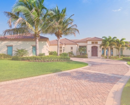 Image 1 (who pays for a home inspection.jpg): "Exterior view of a large, single-story luxury home with a paved driveway, red tile roof, and palm trees in a landscaped yard.